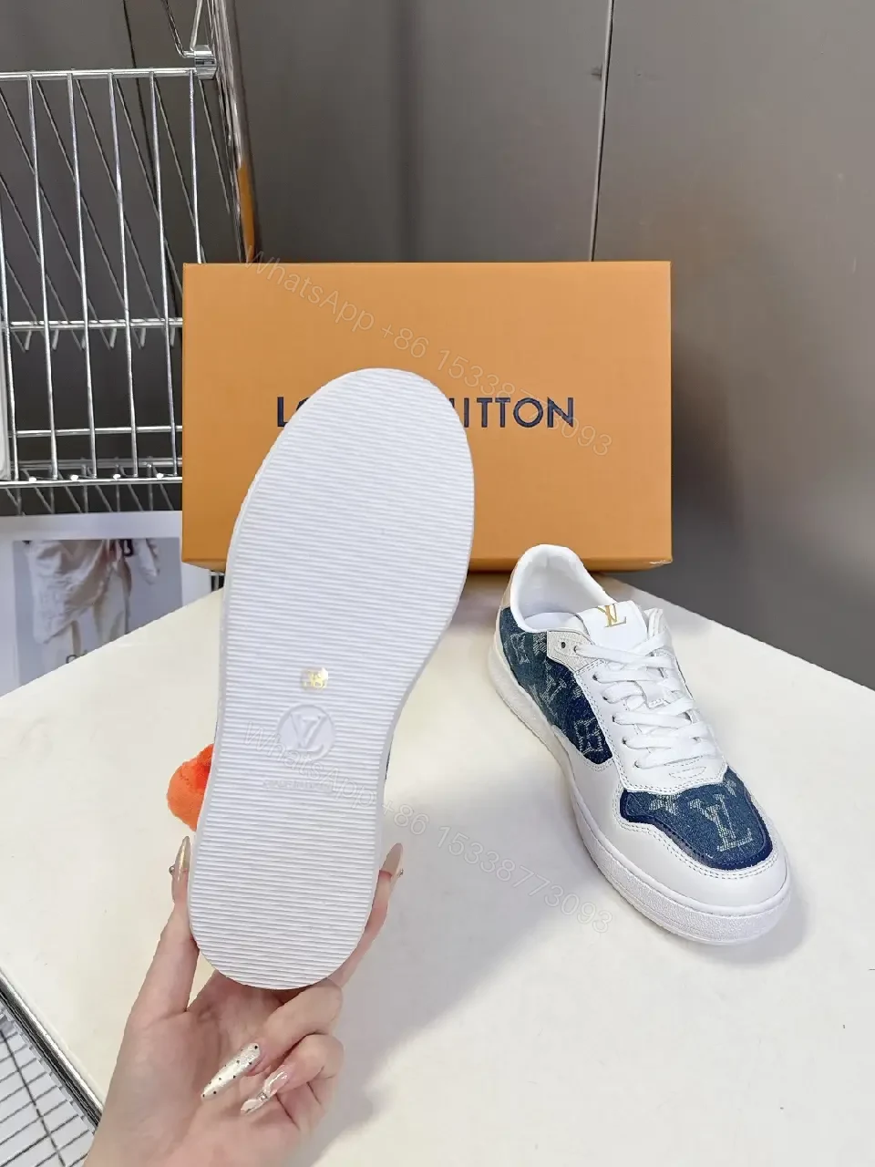 View 9 of Denim-Accent Luxury Sneakers with LV Flair