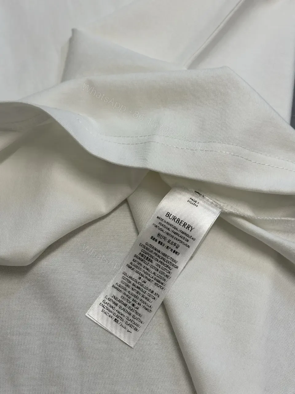 View 7 of Minimalist Burberry-Style White Cotton Tee: Elevated Everyday Comfort