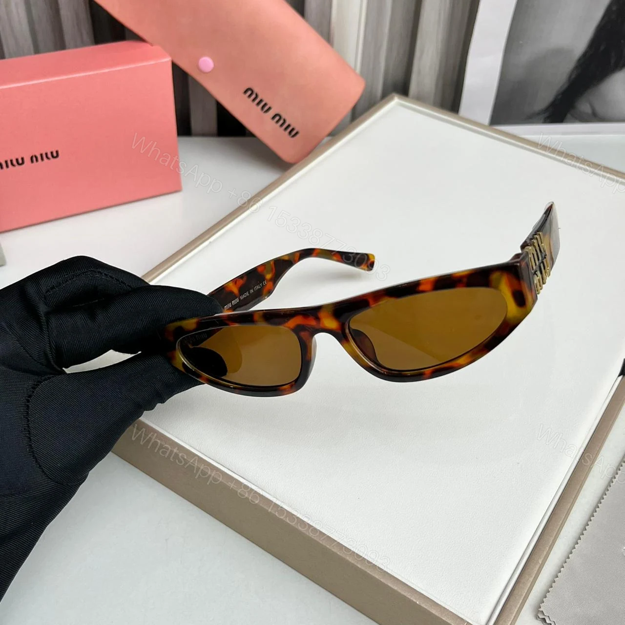 View 2 of Miu Miu Cat Eye Brown Print Sunglasses – One Size