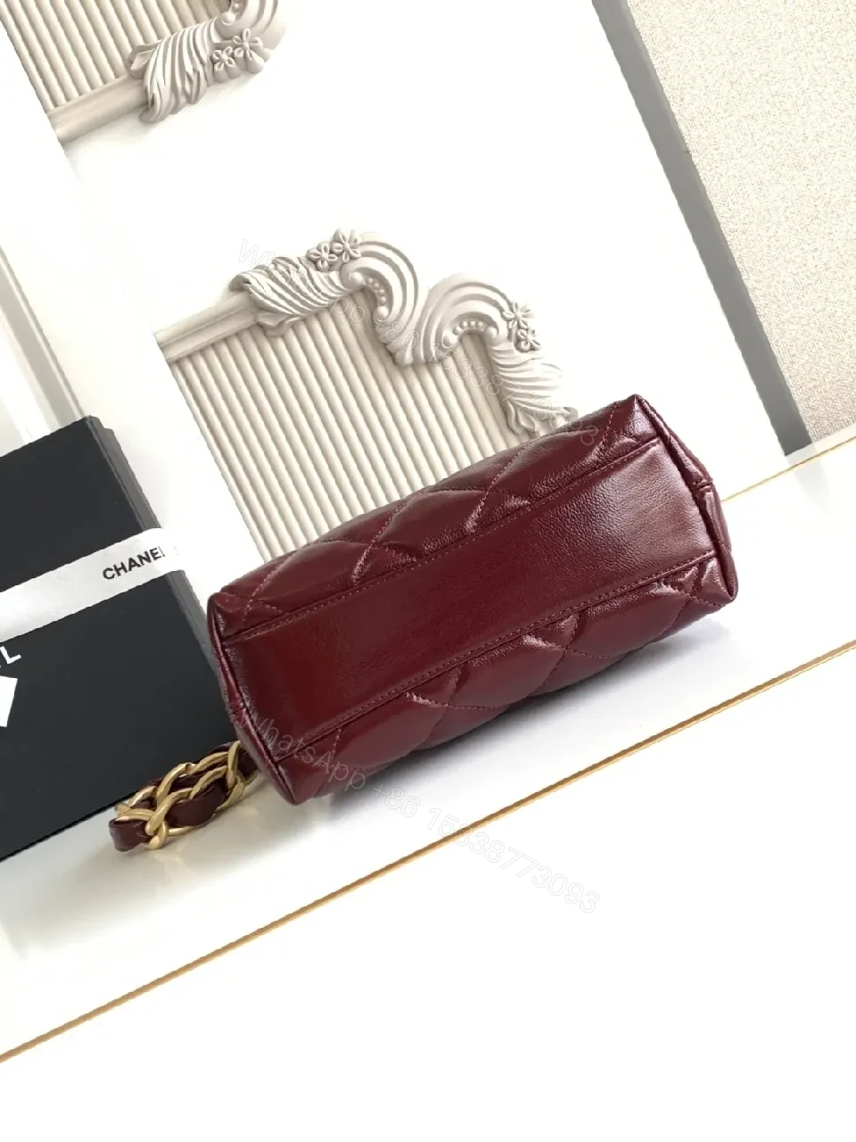 View 2 of Burgundy Quilted Mini Bag with Gold Chain Strap