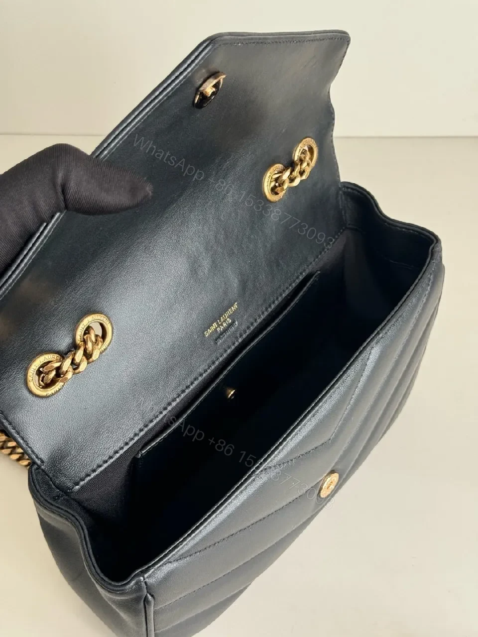View 4 of Quilted Leather Crossbody Bag with Gold Emblem, Luxury Style