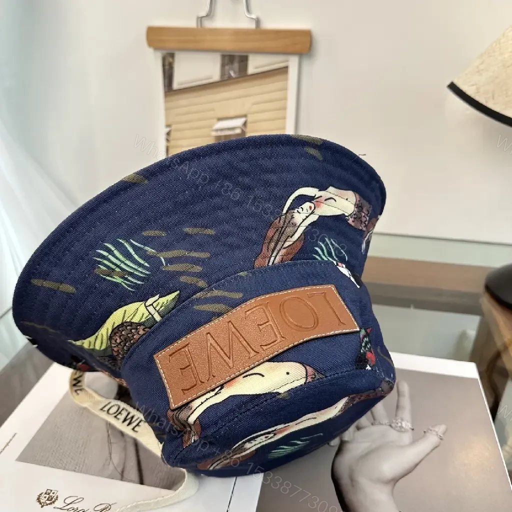 View 9 of Navy Floral Canvas Bucket Hat with Leather Brand Patch