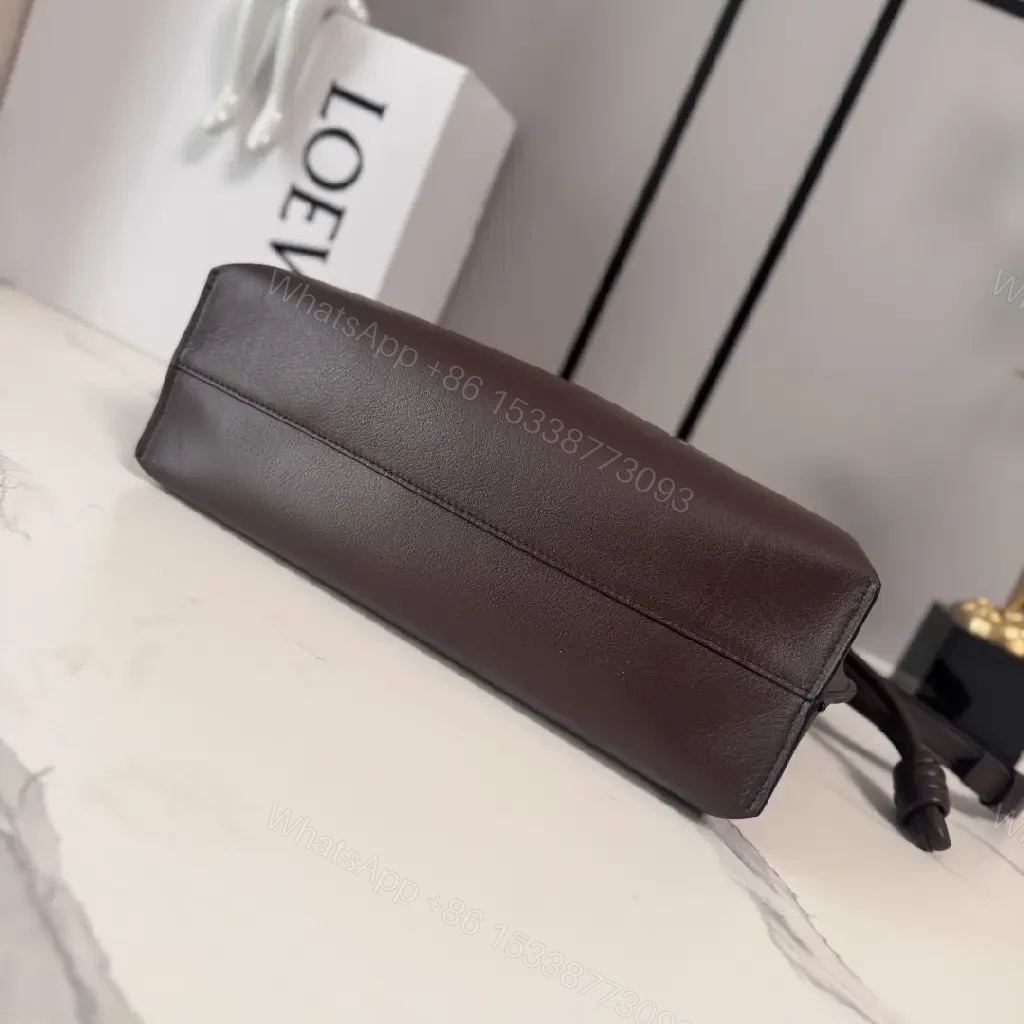 View 9 of Dark Leather Crossbody: Playful Animal Motifs, Compact Chic
