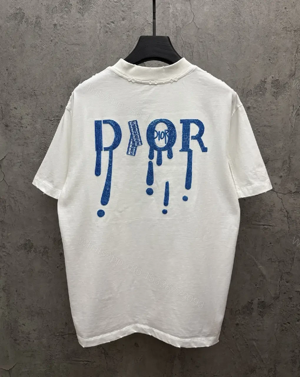 View 4 of Minimalist White Tee with Blue Embroidered Logo, Premium Cotton