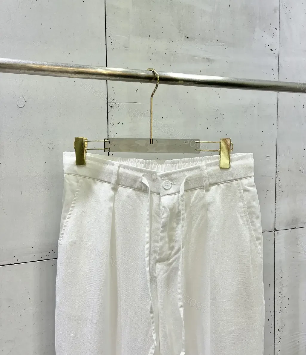 View 10 of Off-White Cream Wide-Leg Trousers with High Waist and Front Fly Closure