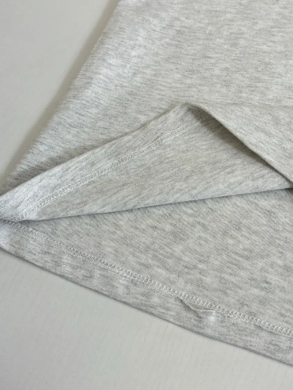 View 9 of Grey Heather Cotton Crewneck Tee — Subtle Luxe Logo, Everyday Comfort