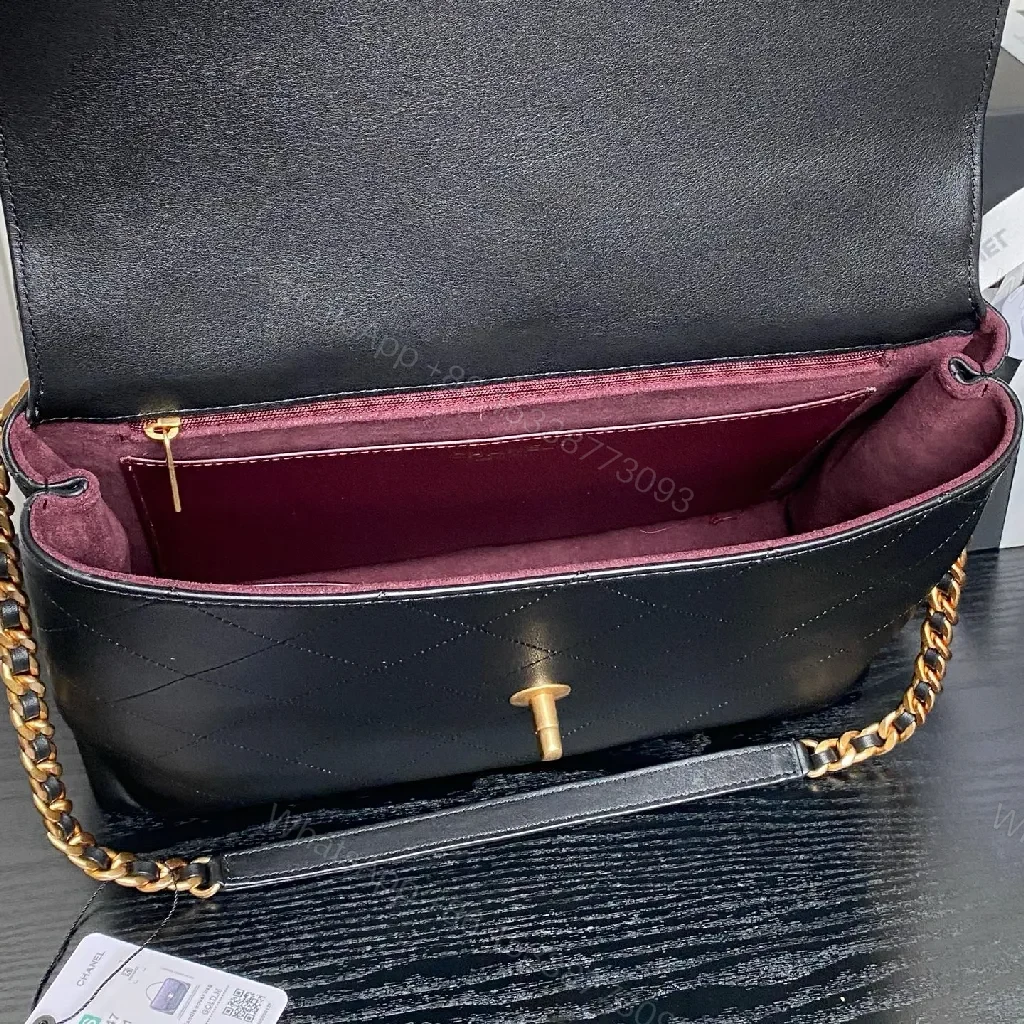 View 2 of Chic Black Quilted Flap Bag with Gold Logo
