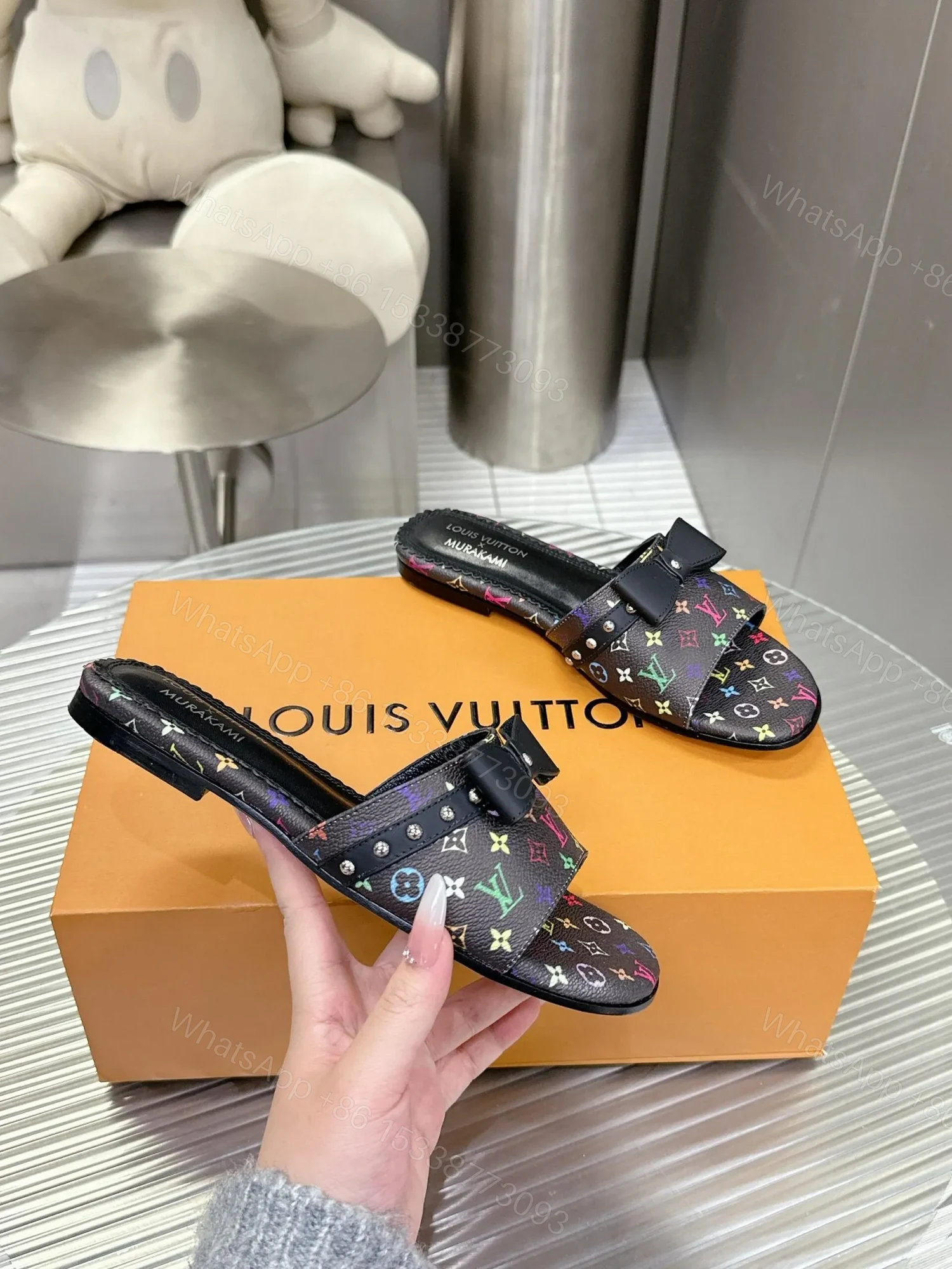 View 6 of LV Women Black Patterned Leather Bow Slide Sandals