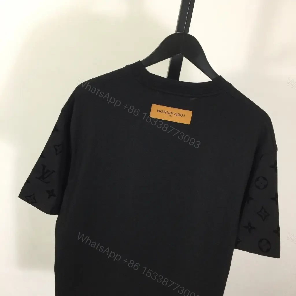 View 8 of Oversized Black Tee with Signature Embellishments — Modern Minimalism