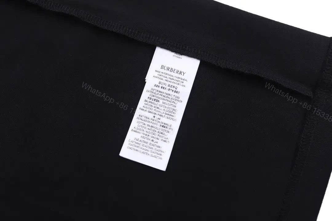 View 11 of Black Cotton Logo Tee: Subtle Crest, Everyday Luxe Top
