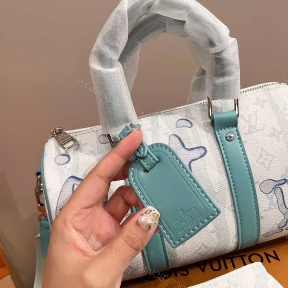 View 3 of Louis Vuitton Keepall Bandouliere Crystal Green 25Cm M22527