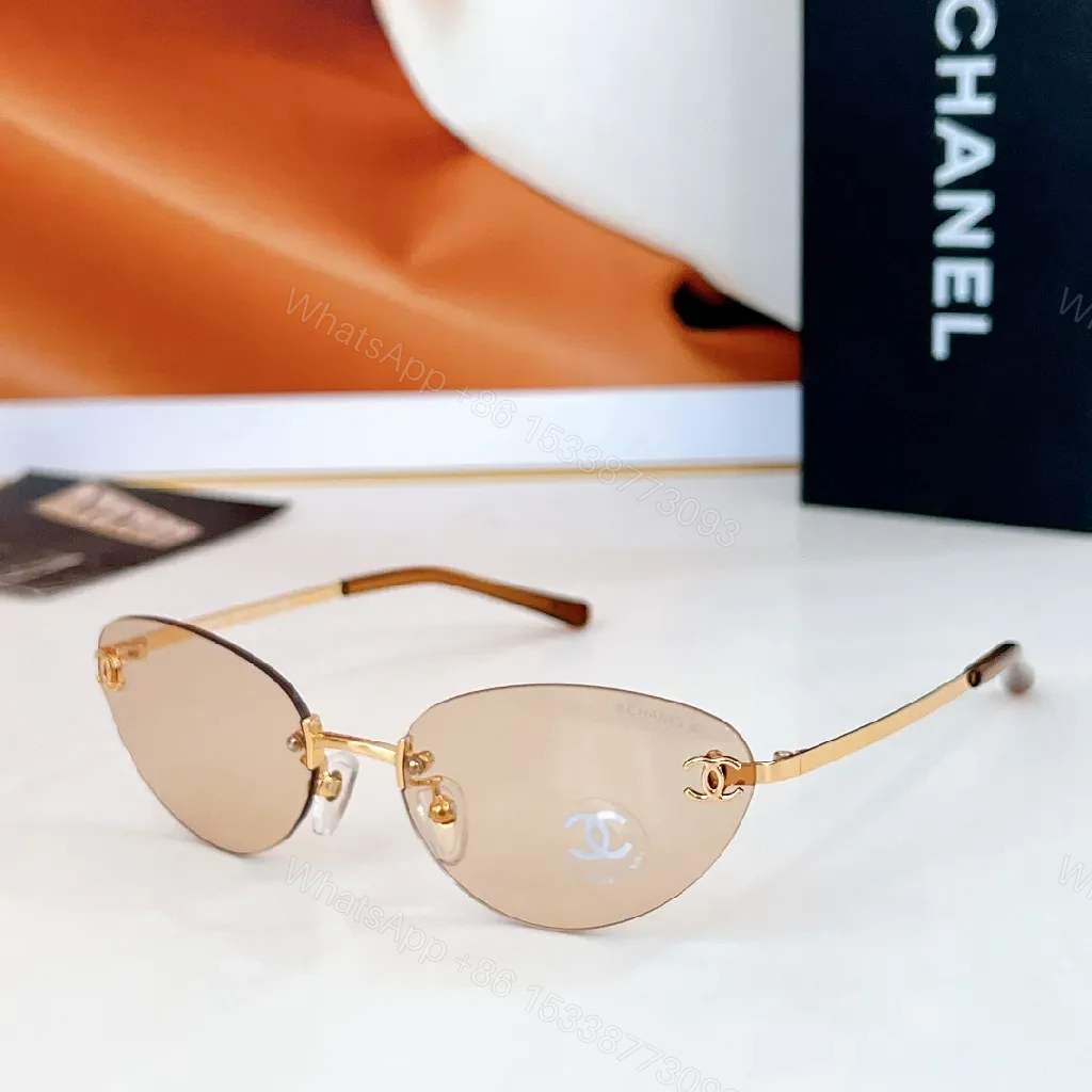 View 6 of Rimless Blue Lens Sunglasses with Gold-Tone Frames