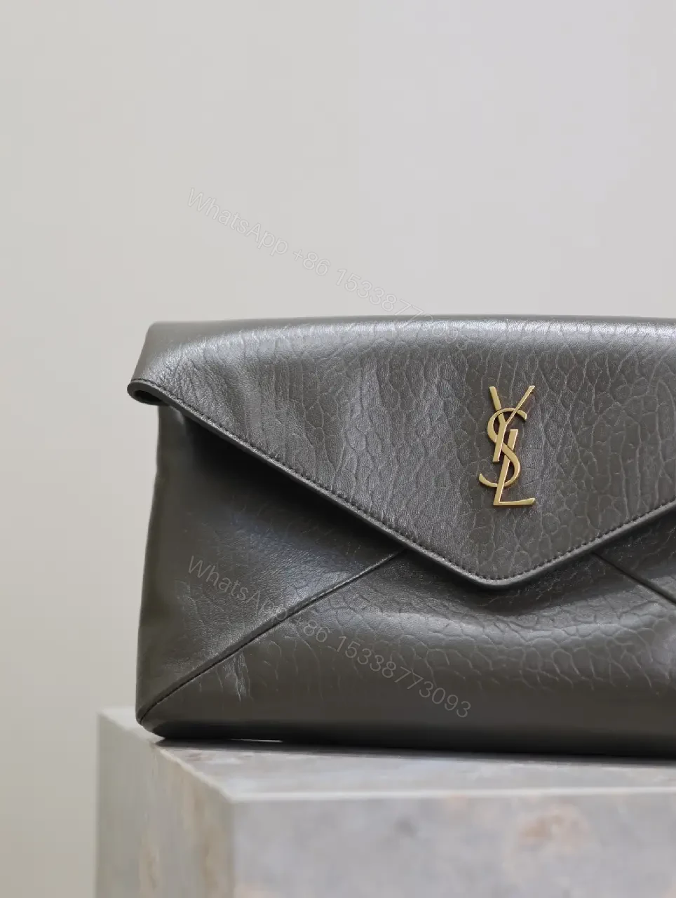 View 8 of Textured Black Leather Envelope Clutch with Gold Logo Signature