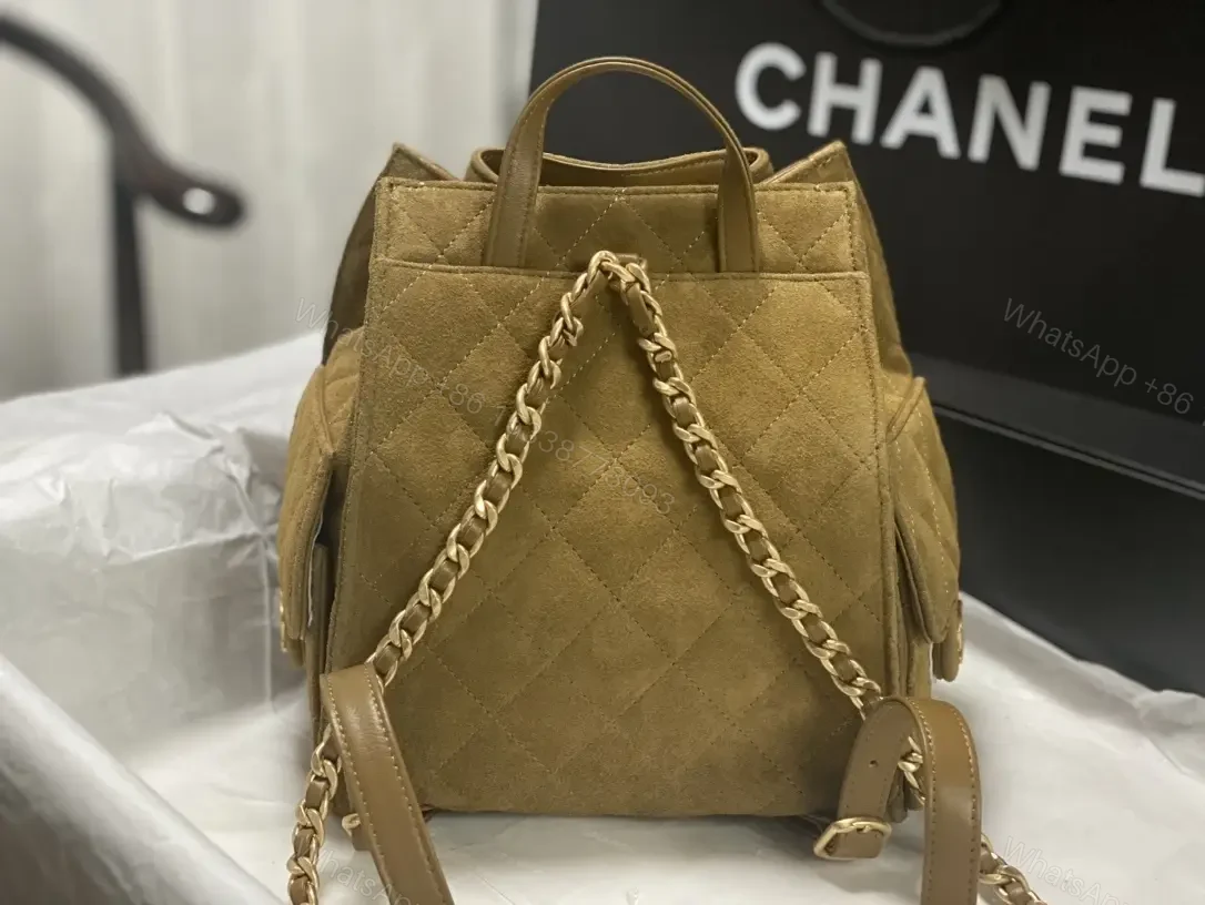 View 4 of Quilted Suede Bucket Bag with Gold Crest Detail