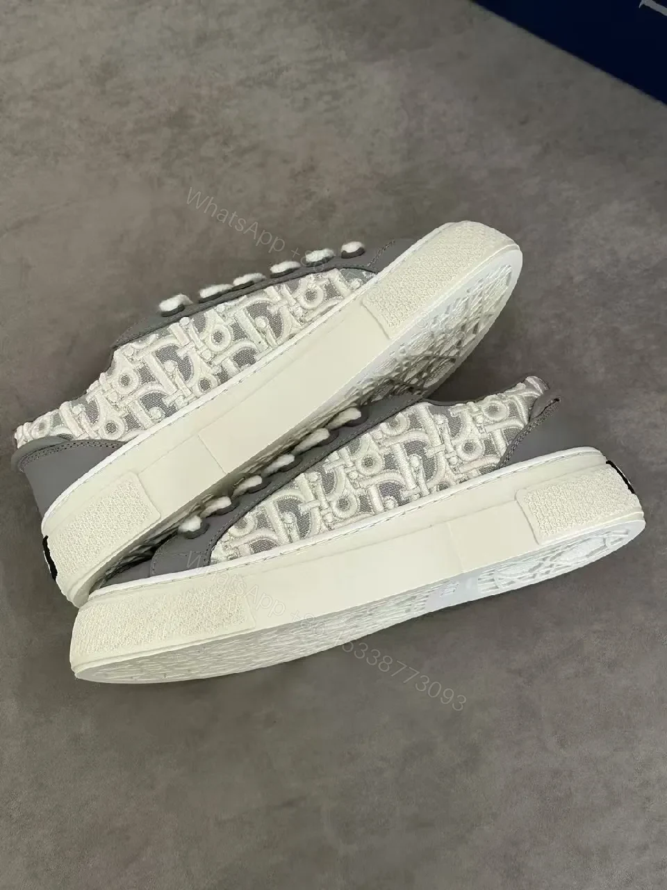 View 8 of Gray Leather Sneaker with Monogram Pattern, Luxurious Texture, Casual High-Tops