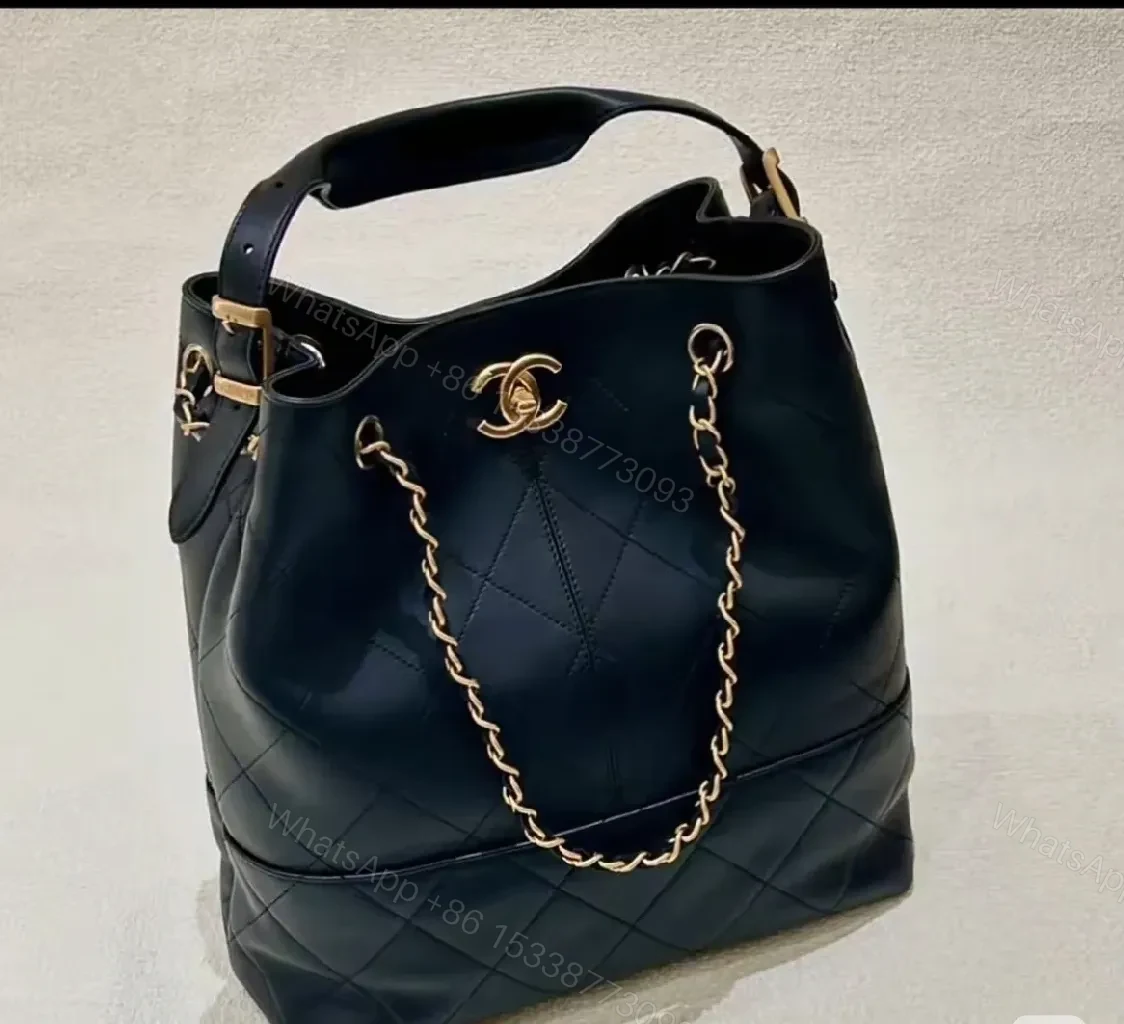View 2 of Black Quilted Bucket Bag with Gold Chain Strap