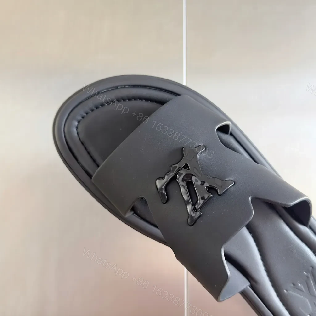 View 7 of Minimalist Black Leather Slides with Signature Emblem