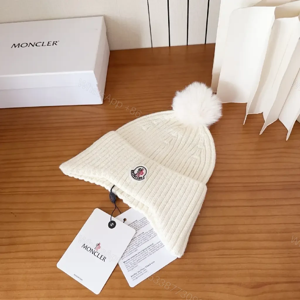 View 3 of Cozy White Knit Beanie with Pom Pom – Luxe Casual Style