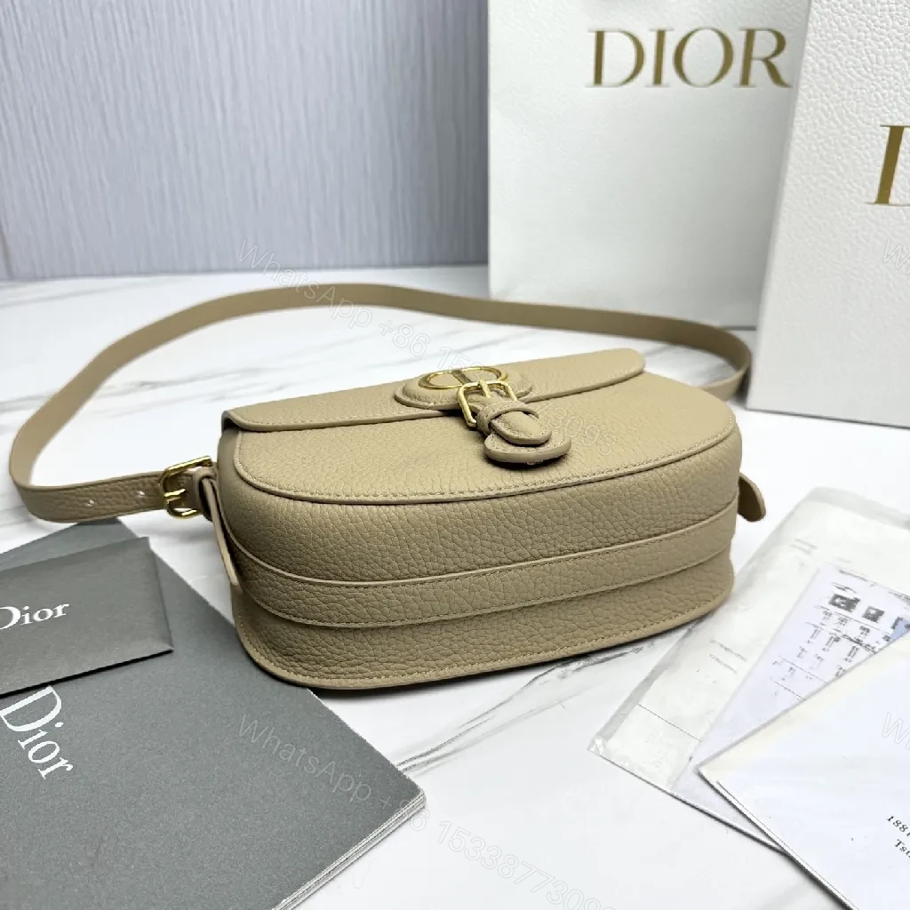 View 2 of Beige Pebbled Leather Saddle Bag — Subtle Texture, Versatile Comfort