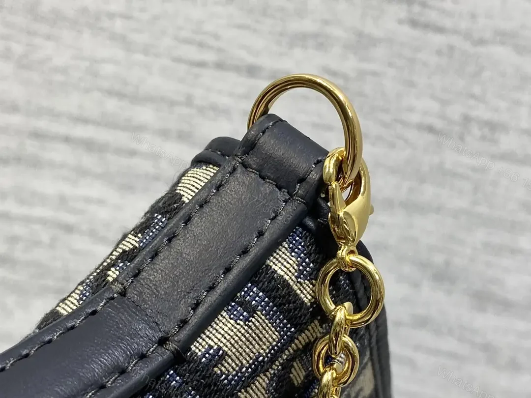 View 9 of Navy monogram canvas leather-trim shoulder bag for everyday luxury
