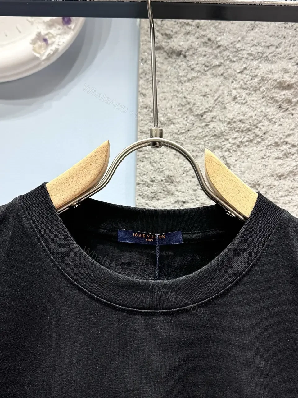 View 11 of Minimalist Black Cotton Tee with Subtle LV.M Logo