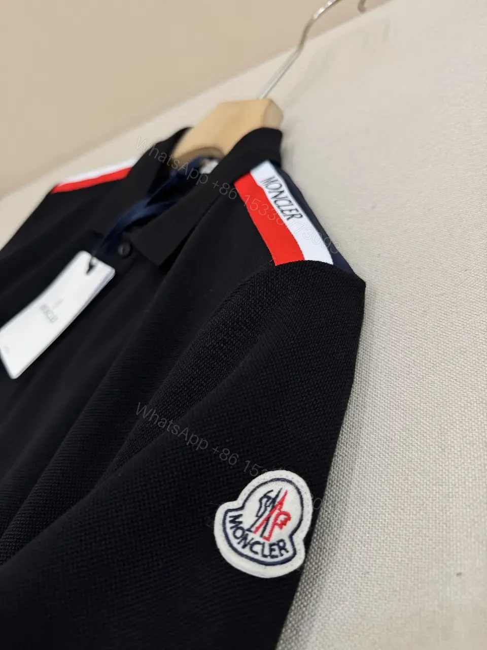 View 10 of Navy cotton polo shirt with red-white striped shoulder accents for everyday luxury