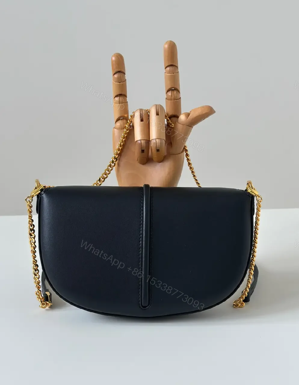 View 2 of Chic Black Leather Shoulder Bag with Gold Hardware, Compact Luxury