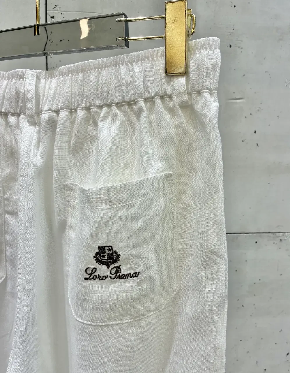 View 5 of Off-White Cream Wide-Leg Trousers with High Waist and Front Fly Closure