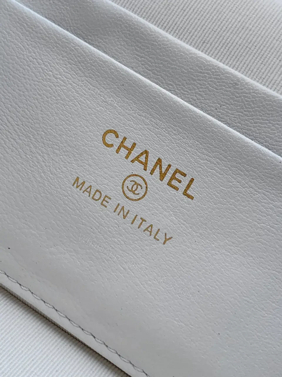 View 2 of White Quilted Mini Bag with Gold Hardware, Sleek Chic Carryall