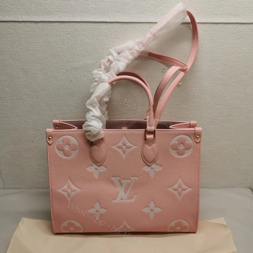 View 2 of Louis Vuitton Onthego MM Monogram Empreinte Leather Trianon Pink 33Cm M46286