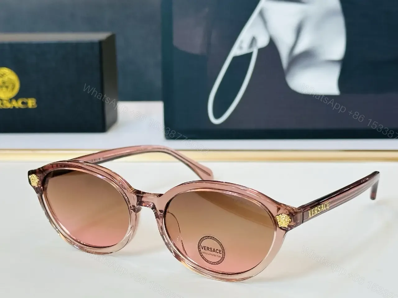 View 6 of Glassy Black Round Sunglasses with Gold Accents, UV400 Protection