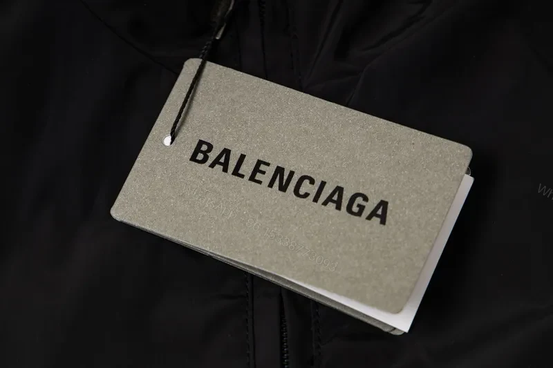 View 8 of Minimalist Black Windbreaker: Subtle Branding, All-Season Outerwear