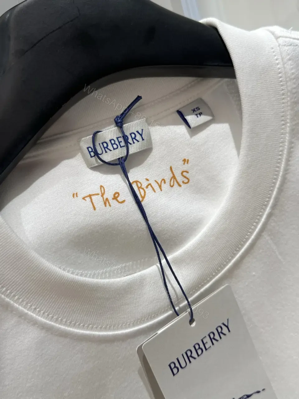 View 3 of White Cotton Oversized T-Shirt with Burberry Graphic Front
