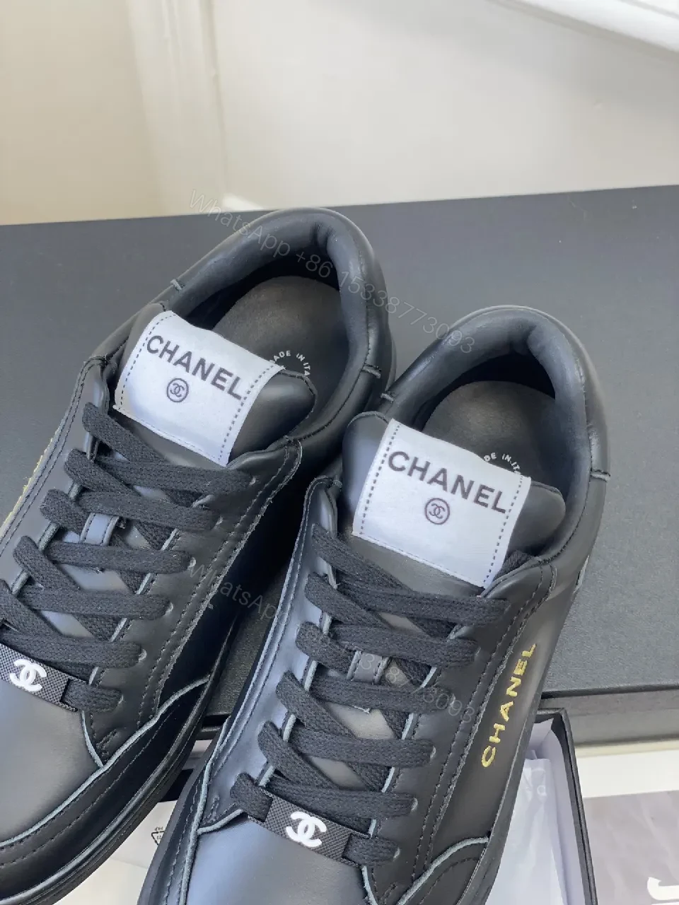 View 3 of Black Leather Sneakers, Subtle Gold Accents, High-Top Style, Everyday Luxury