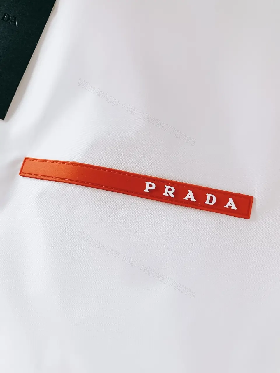 View 6 of White Nylon Windbreaker with Red Accent — Lightweight, Weather-Ready Outerwear