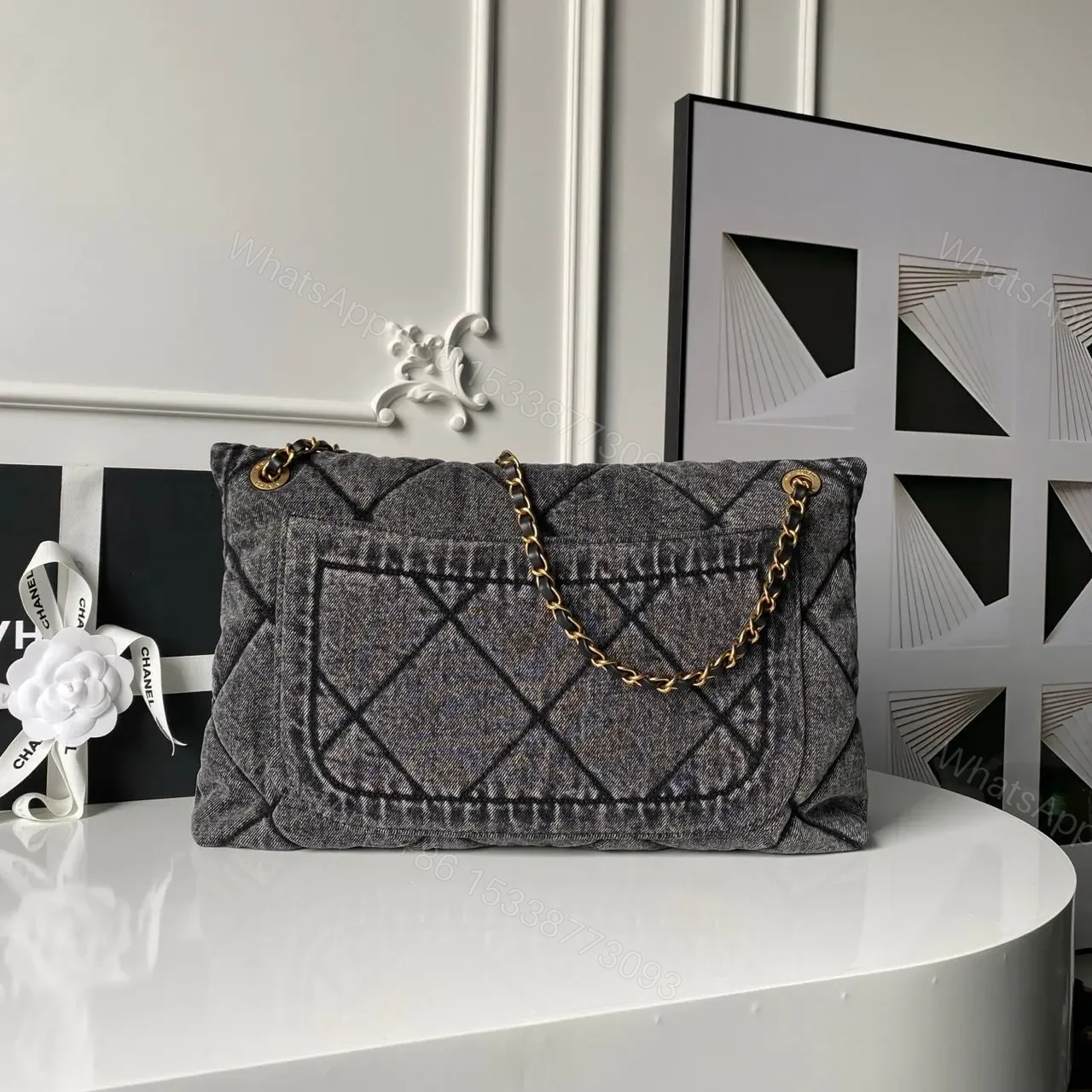 View 2 of Chanel Maxi Flapbag in washed denim with gold-tone metal hardware
