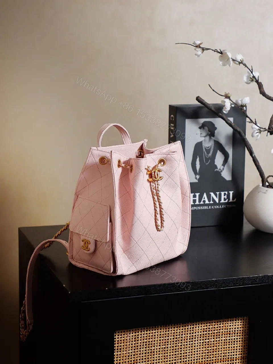 View 4 of Soft Pink Quilted Bucket Bag with Gold Charm, Faux-Leather Bag