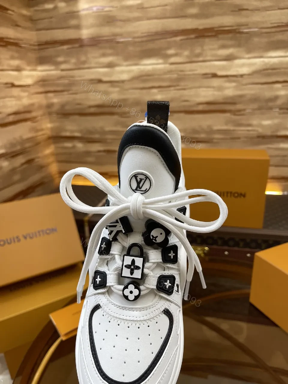 View 4 of Premium Leather High-Top Sneakers with LV Embellishments