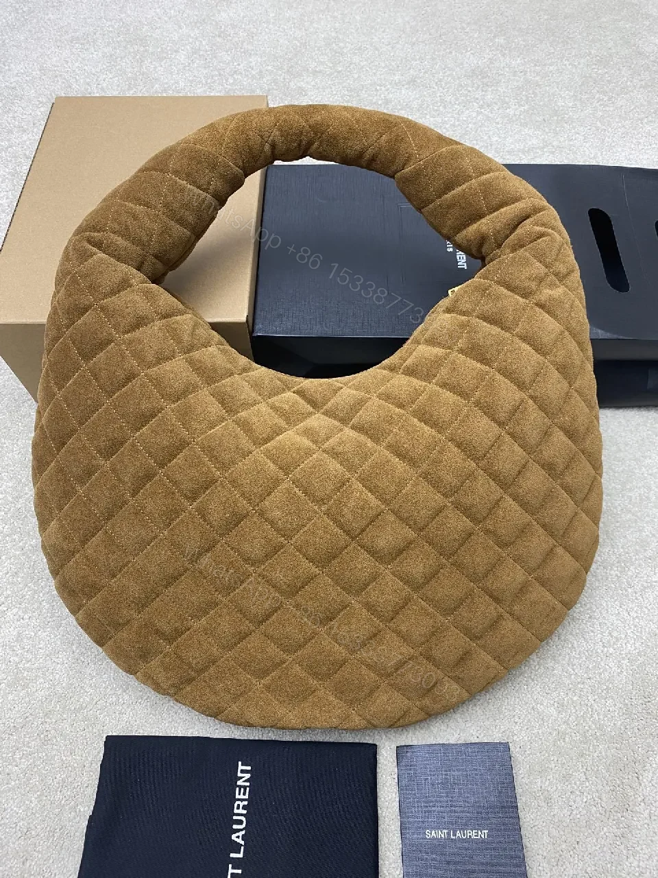 View 8 of Taupe Quilted Circle Bag - Luxury Style, Plush Top-Handle, Iconic Hardware