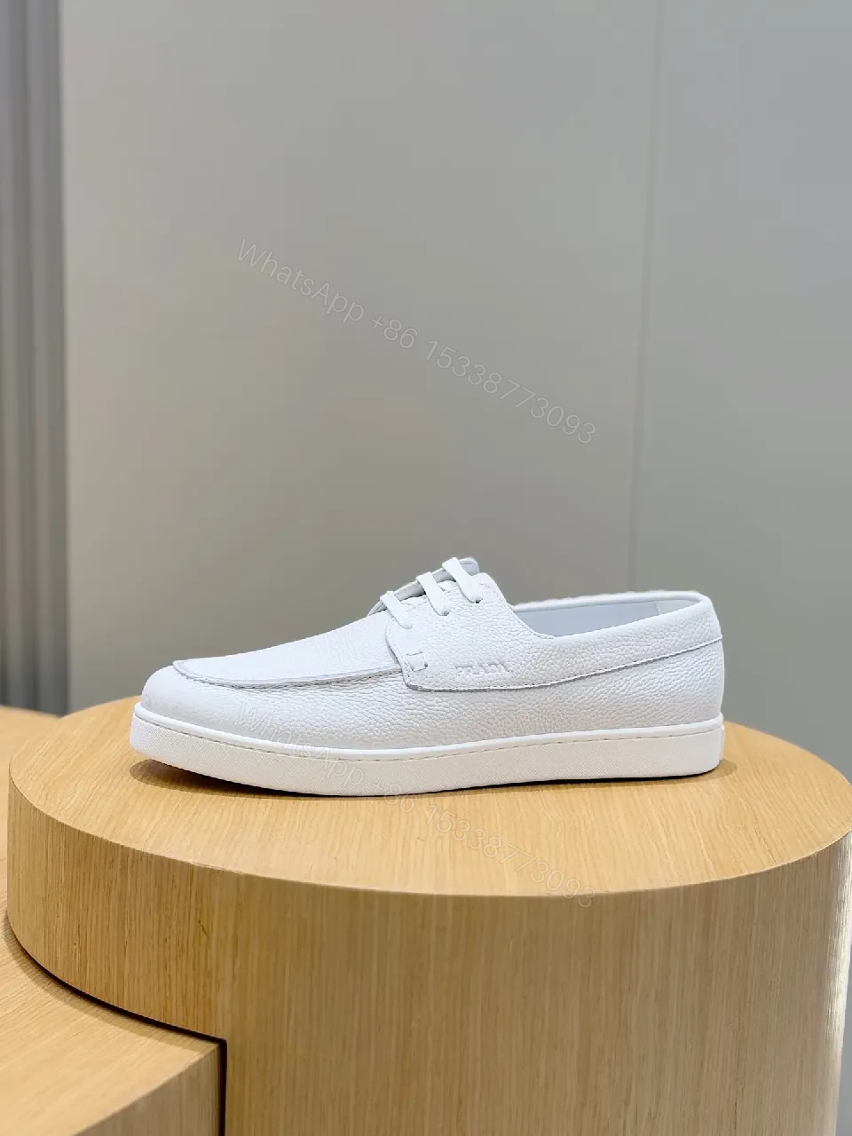 View 9 of Minimalist White Leather Low-Top Sneakers with Subtle Luxury Details