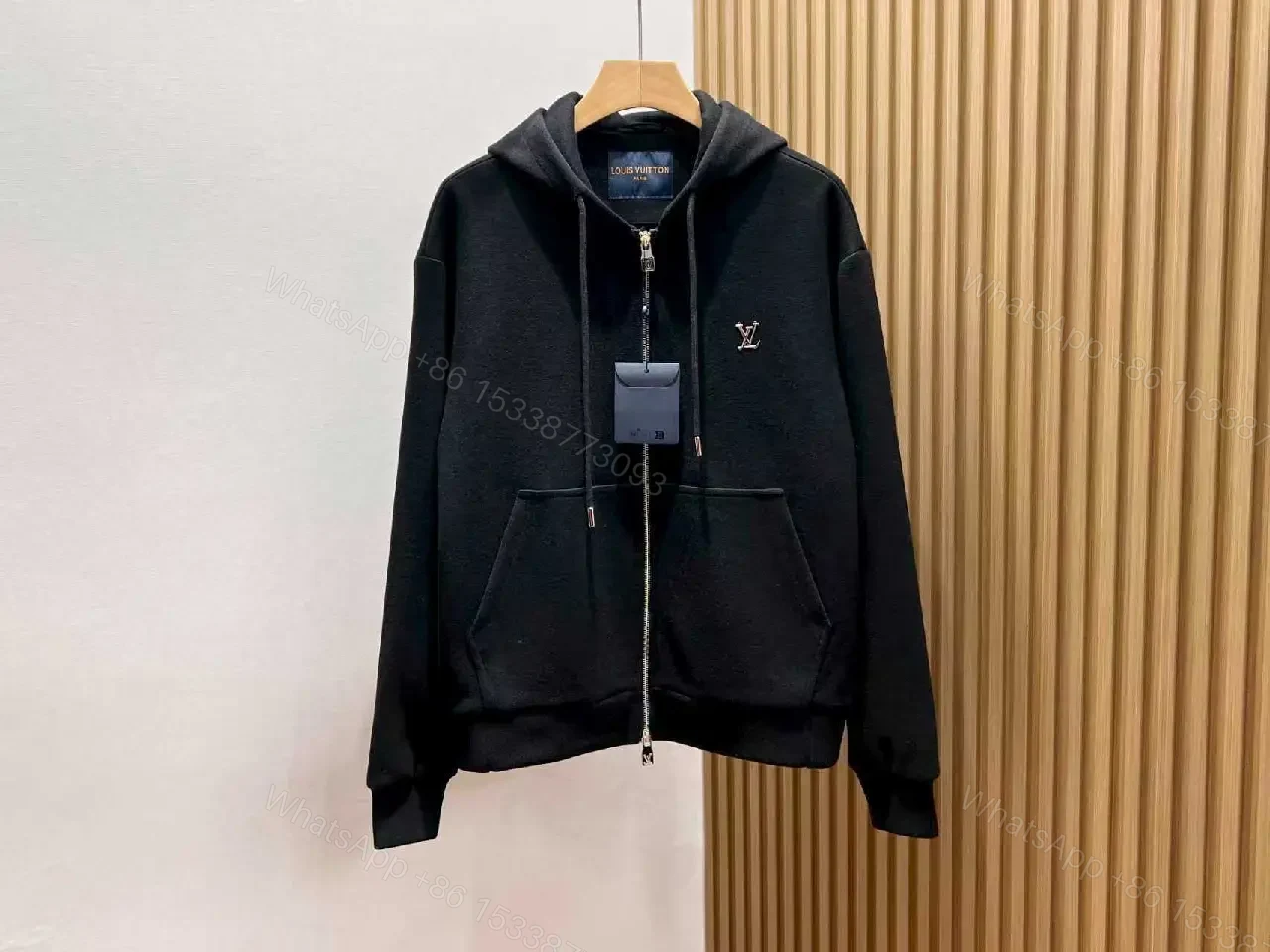 Cozy Black Knit Zip Hoodie with Subtle Emblem Embellishment — view 1