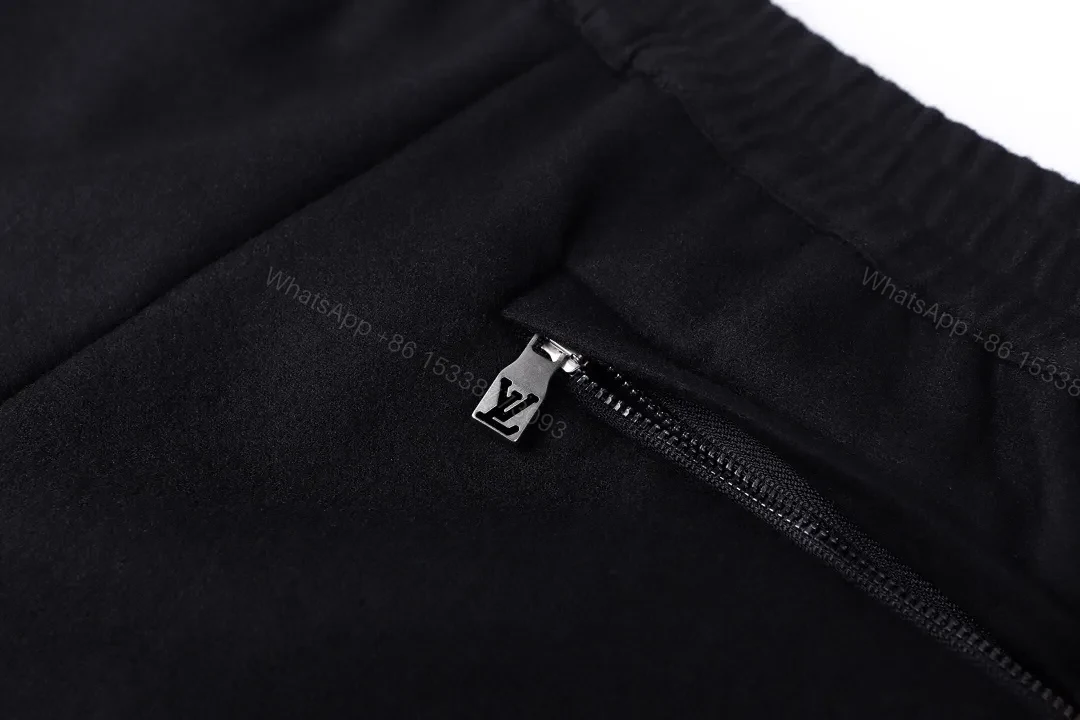 View 2 of Chic Black Wide-Leg Track Pants with Subtle Monogram Monstère