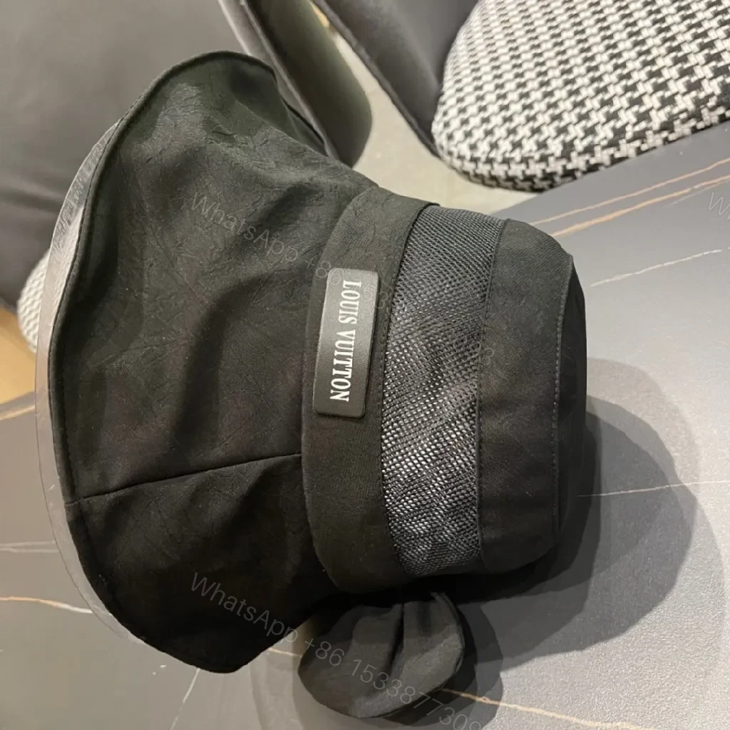 View 2 of Minimalist Black Bucket Hat with Discreet Luxe Label