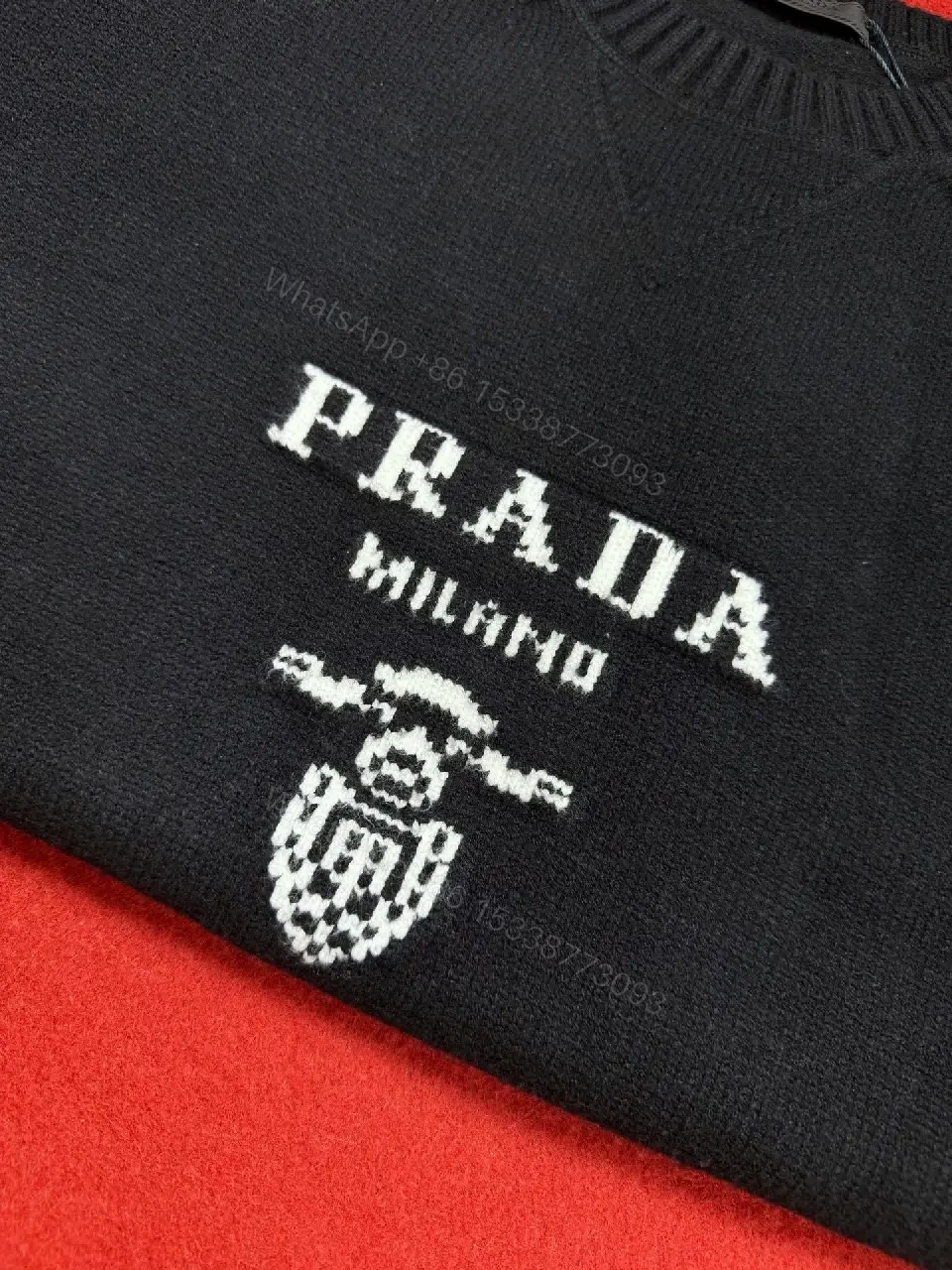 View 9 of Black Knit Pullover with Crest – Elevated Comfort Knitwear