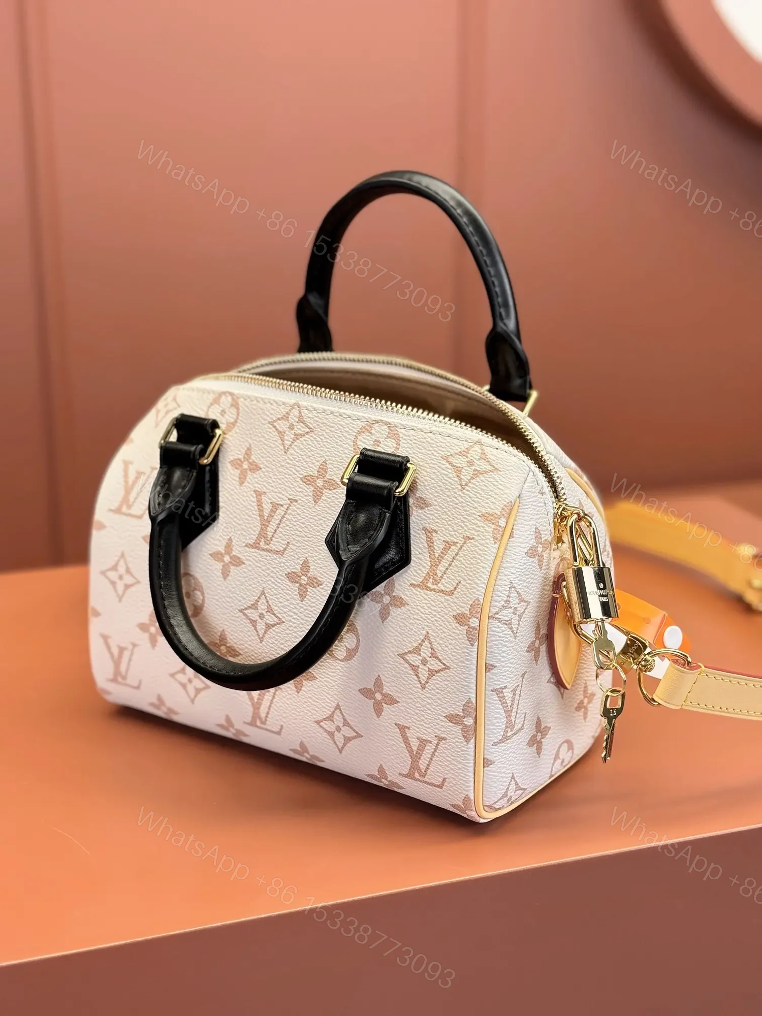 View 6 of Louis Vuitton Monogram Dune Speedy Bandoulière 20