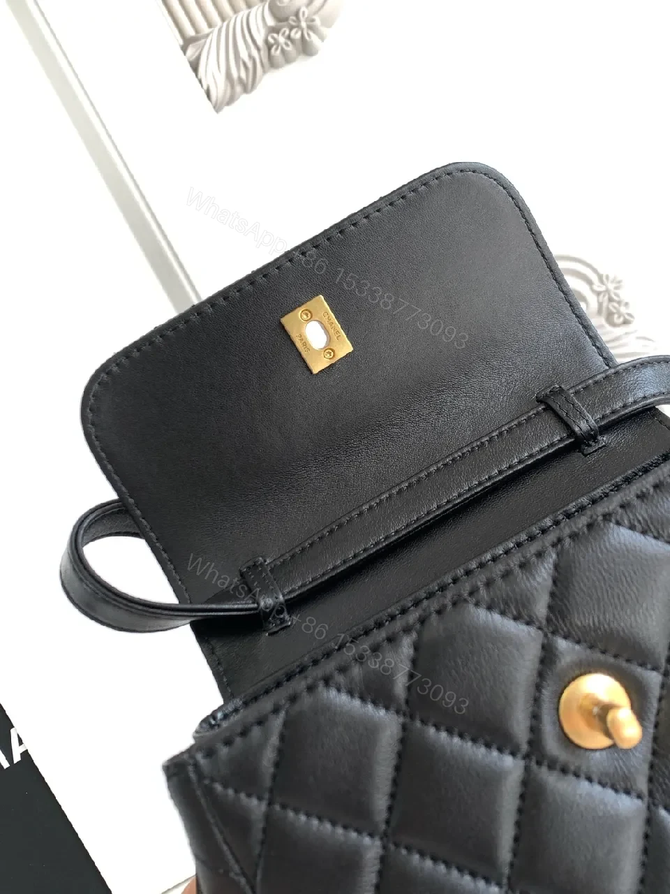 View 8 of Compact Black Quilted Bag with Gold Hardware