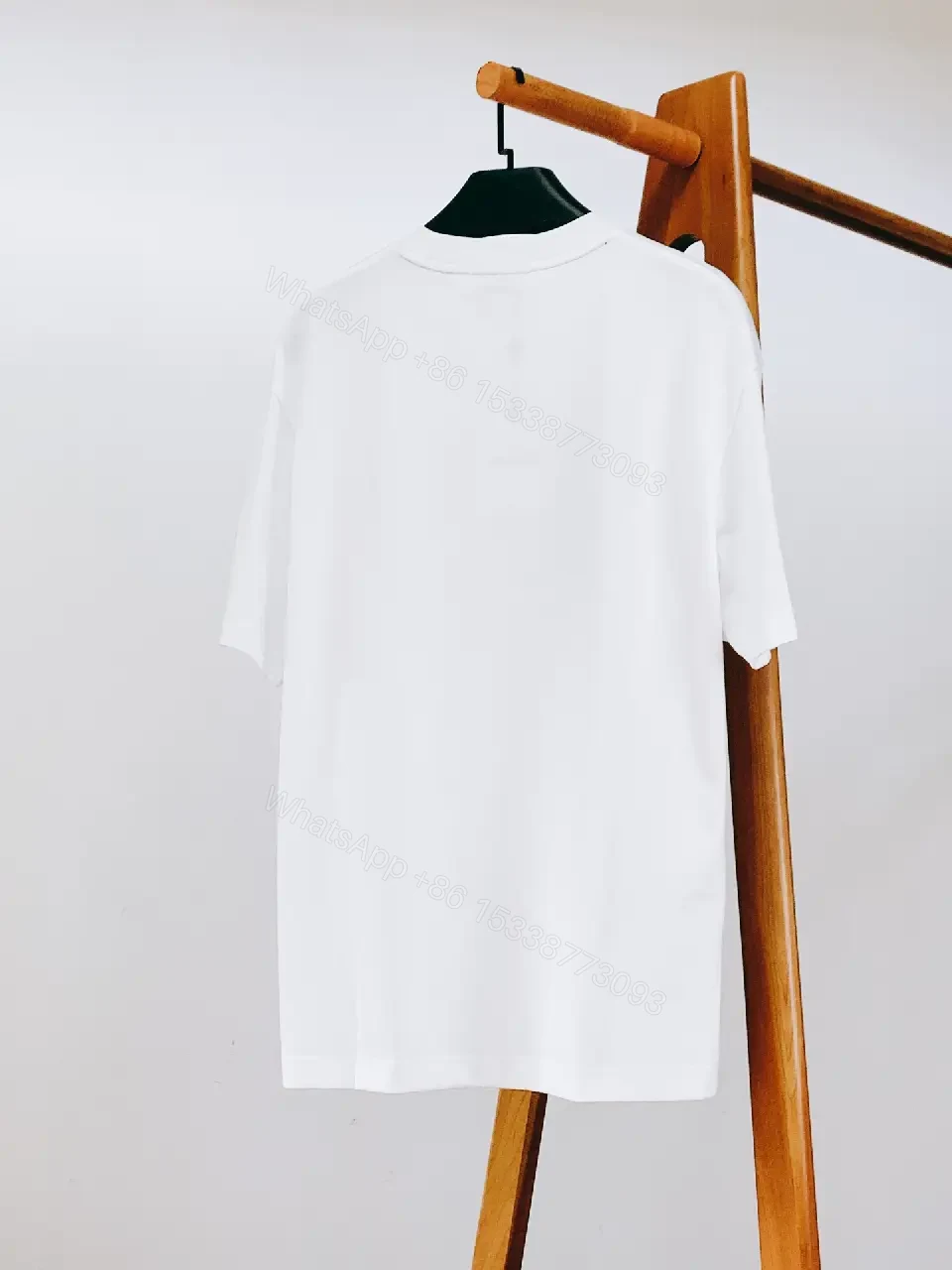 View 4 of White Cotton Crewneck Tee – Graphic Crest, Modern Luxe, Everyday Essential