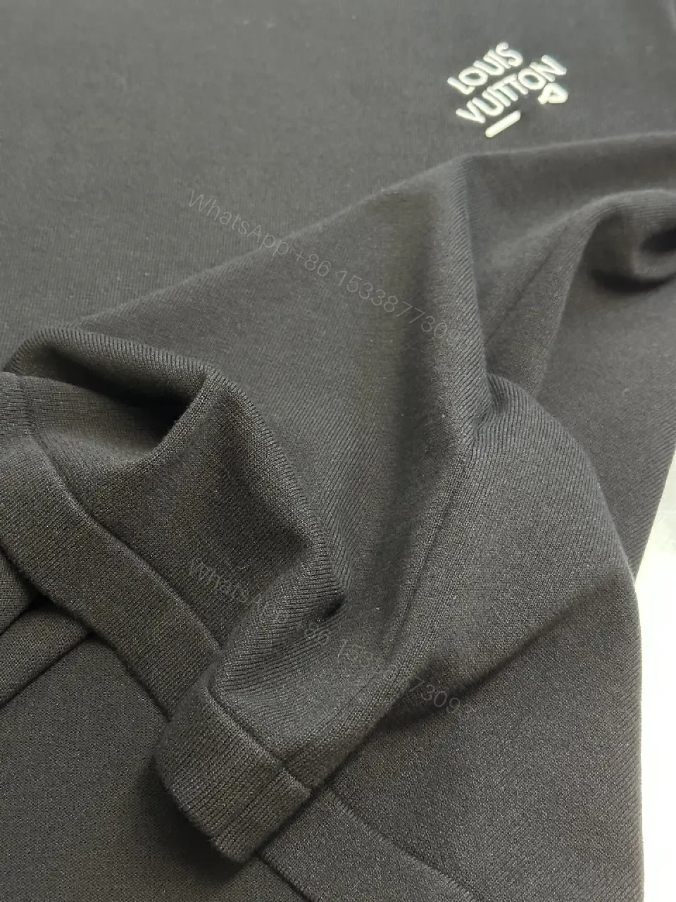 View 3 of Minimalist Black Crewneck Tee Dress – Subtle Logo, Versatile Dress