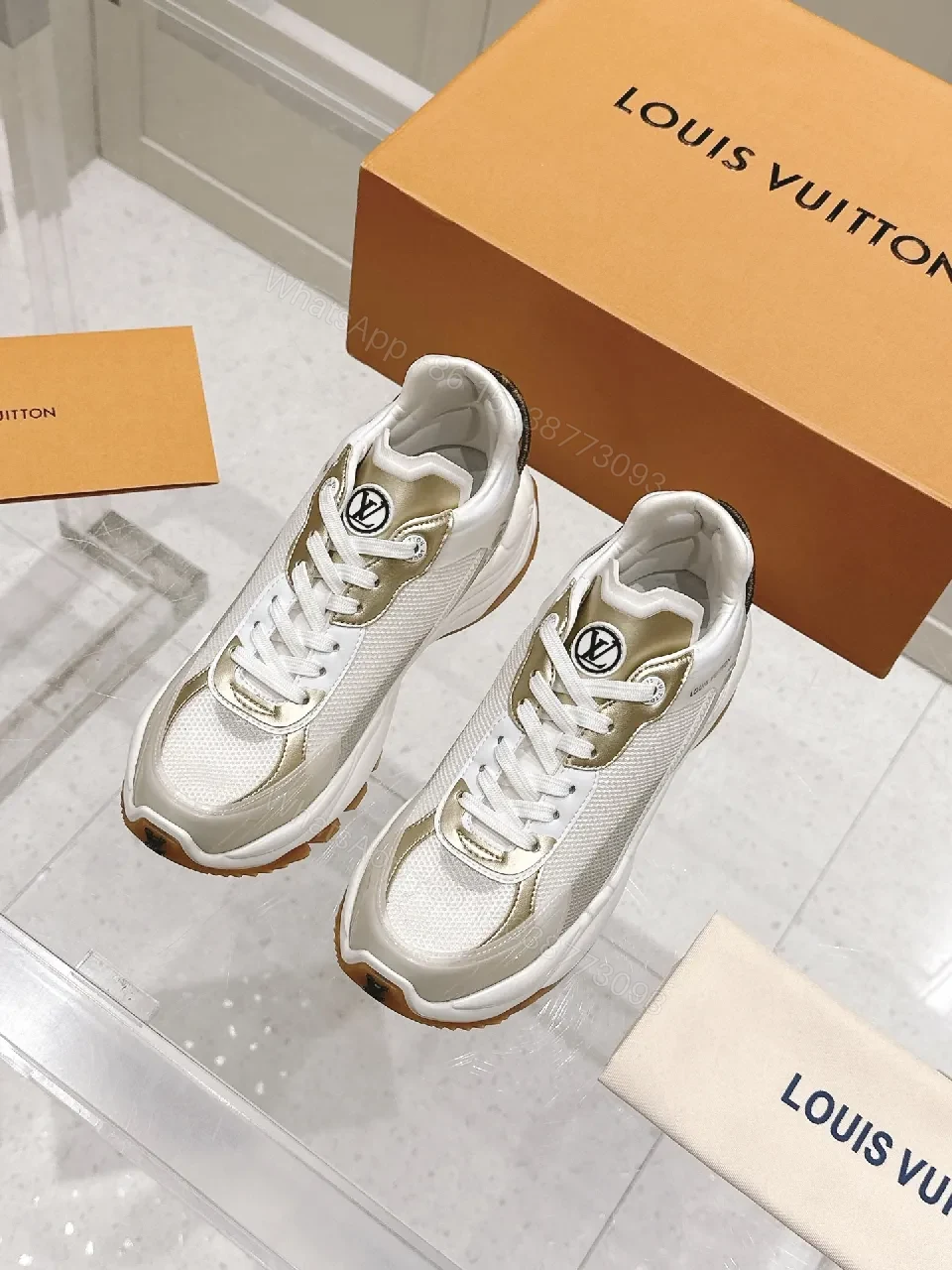 View 9 of Chunky White & Gold Luxe High-Tops: Signature LV Motif Sneakers
