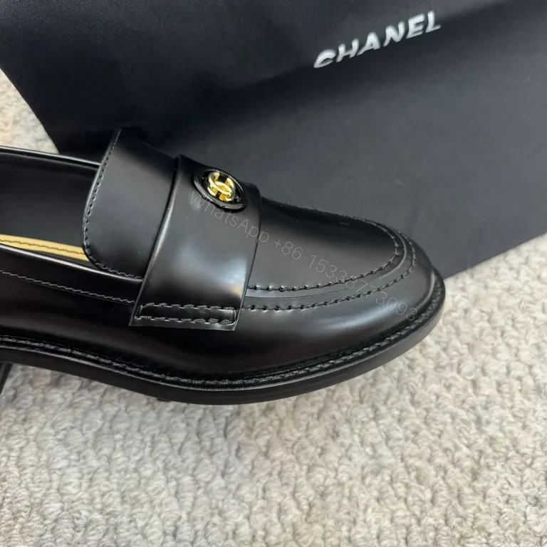 View 7 of Refined Black Leather Loafers with Gold Crest â€“ Luxe Comfort
